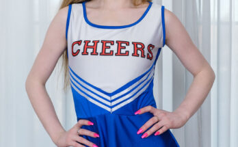 sweet blonde British girl in sexy cheerleader costume